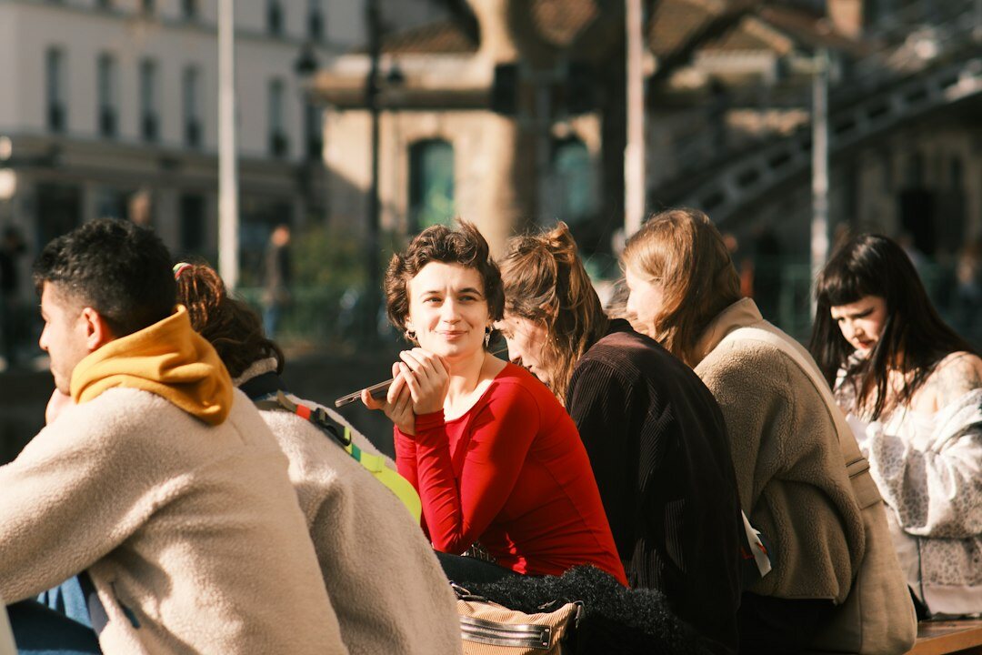 people in city street talking